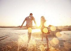 couple running on the beach